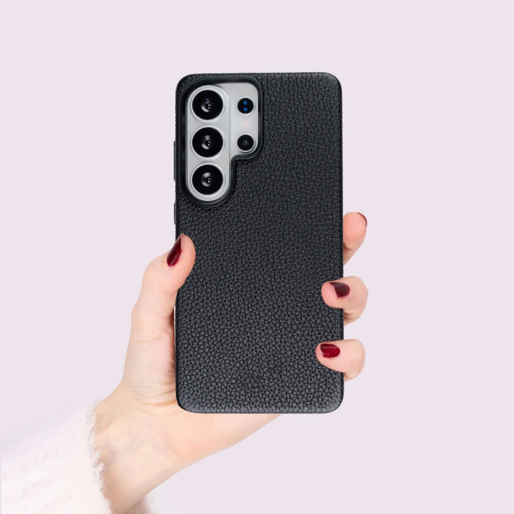 hand holding a pebbled leather phone case